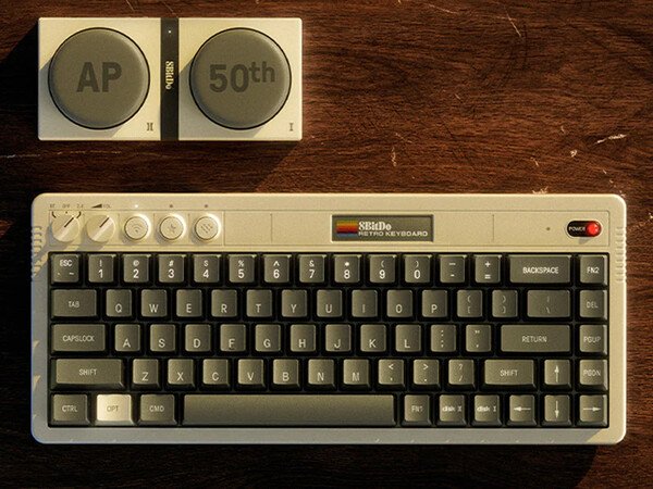 The 8BitDo Retro 68 Keyboard AP50th Limited Edition comes with two wireless super buttons.