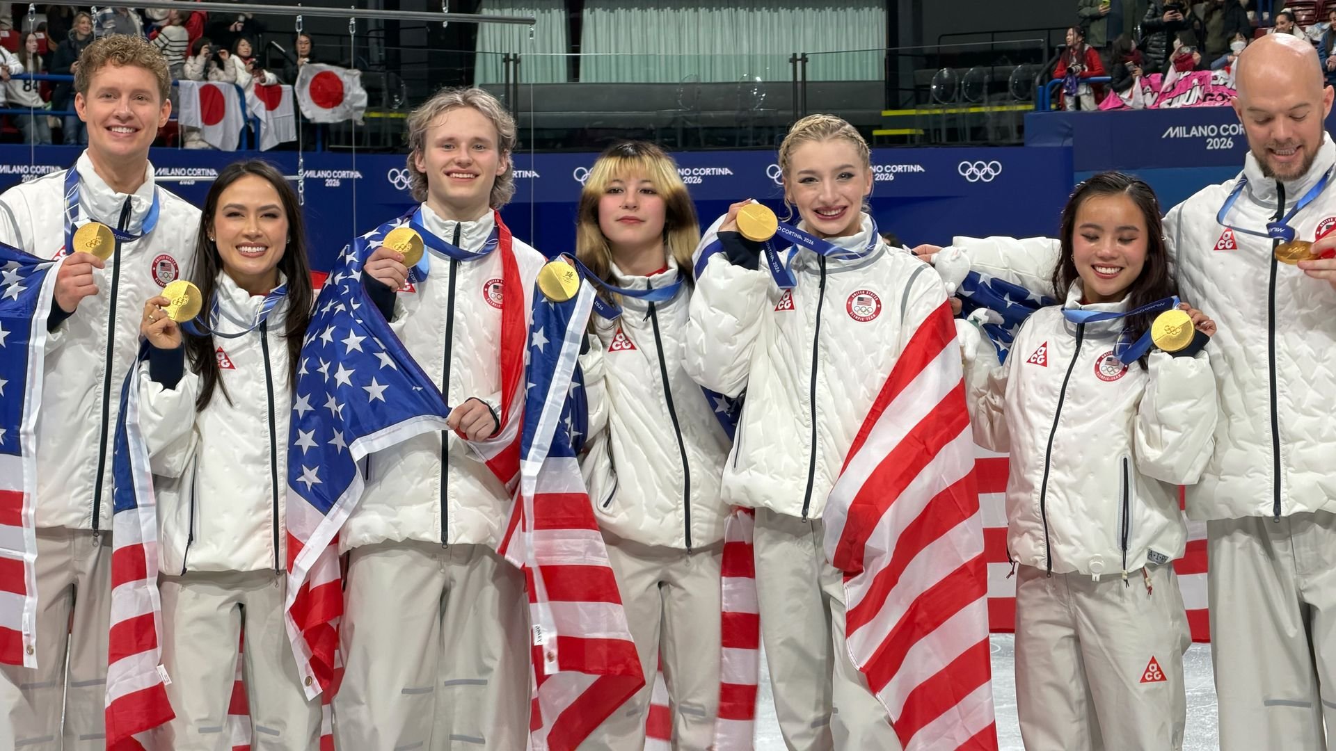 U.S. figure skaters celebrate winning the gold in the team event.