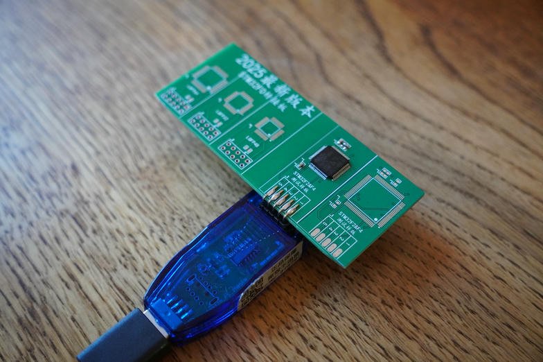 STM32F205RBT6 soldered onto the adapter board and plugged into the USB dongle
