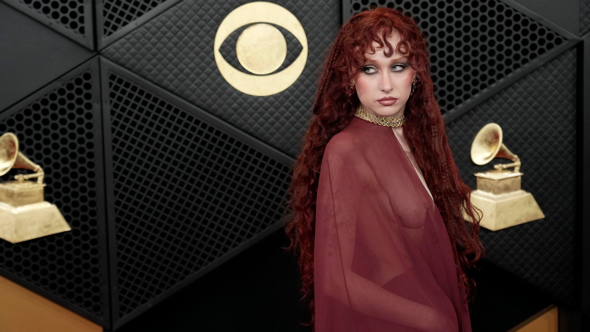 Chappell Roan on the red carpet at the Grammy Awards with the CBS logo in the background