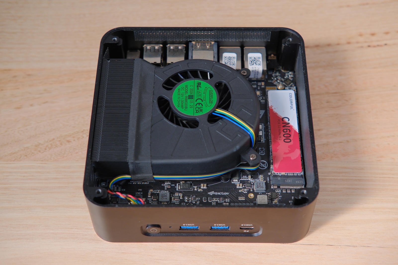 Inside the bottom of the M700S showing a large blower fan and M.2 NVMe drive.