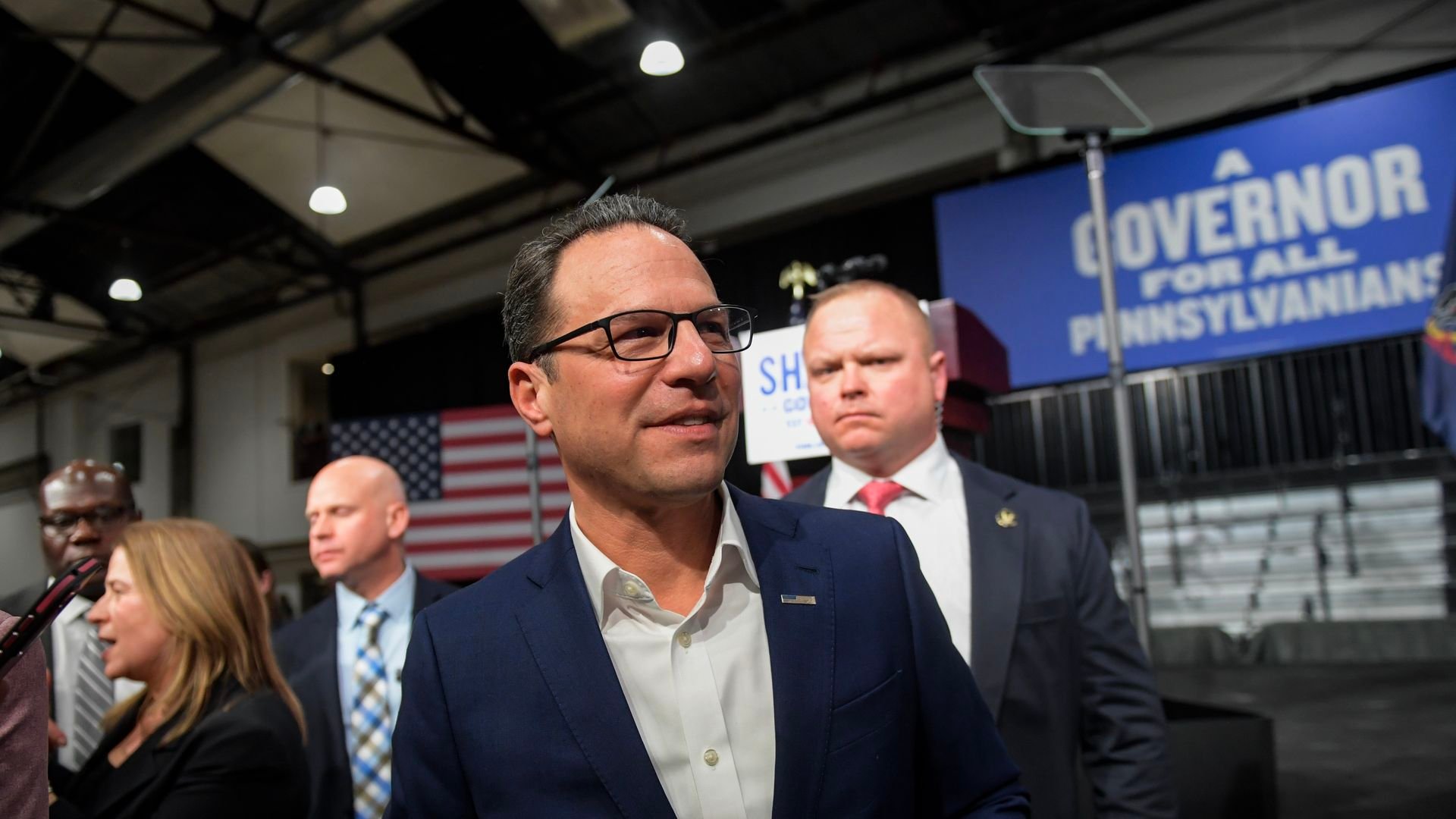 Pennsylvania Gov. Josh Shapiro at a campaign event with people in the background.