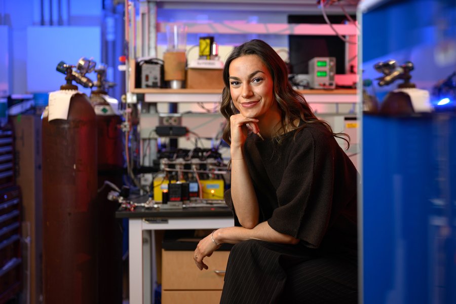 Audrey Parker seated in lab with blue lighting.