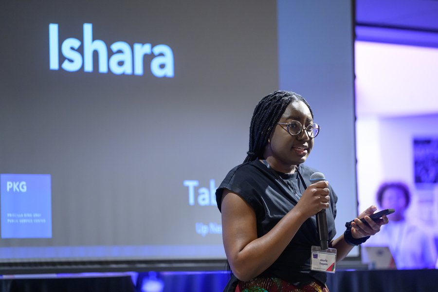 Akorfa Dagadu speaks at an indoor presentation. The word