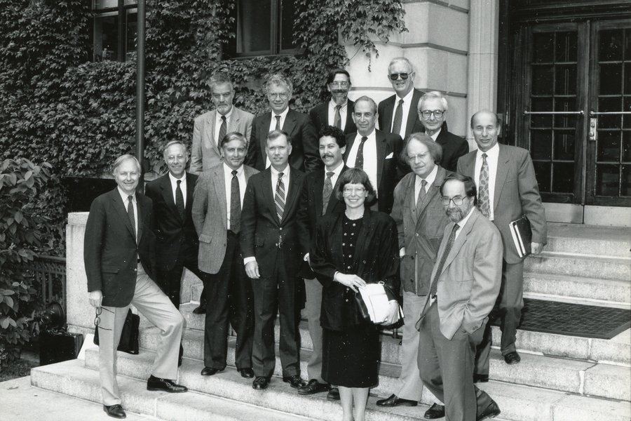 Black-and-white photo of 15 people standing on outdoor steps. Harriet Latham Robinson is the sole woman in the image.