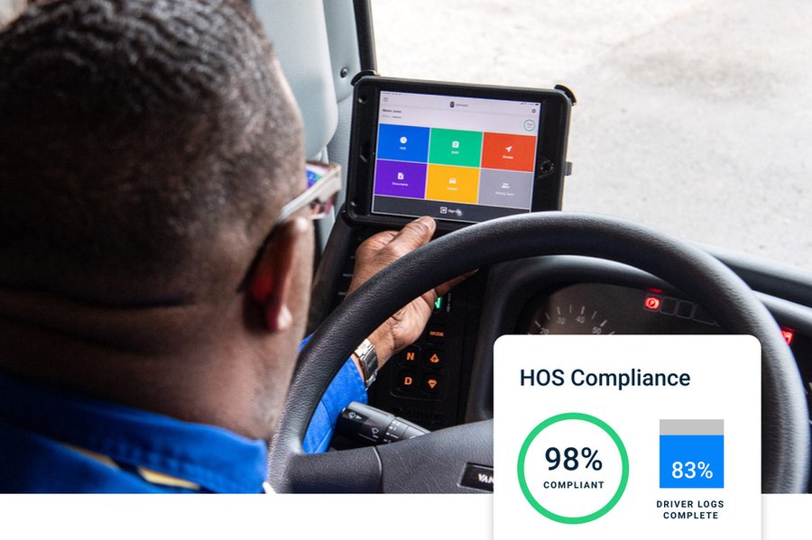 A driver checking a digital compliance interface