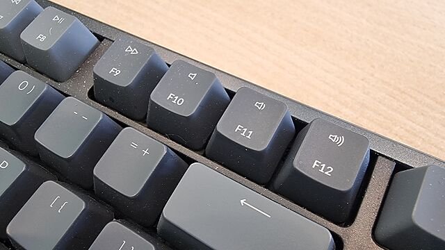 Close-up of Mac-style double-duty function keys F9 through F12, for fast-forward, mute, volume-down and volume-up respectively.