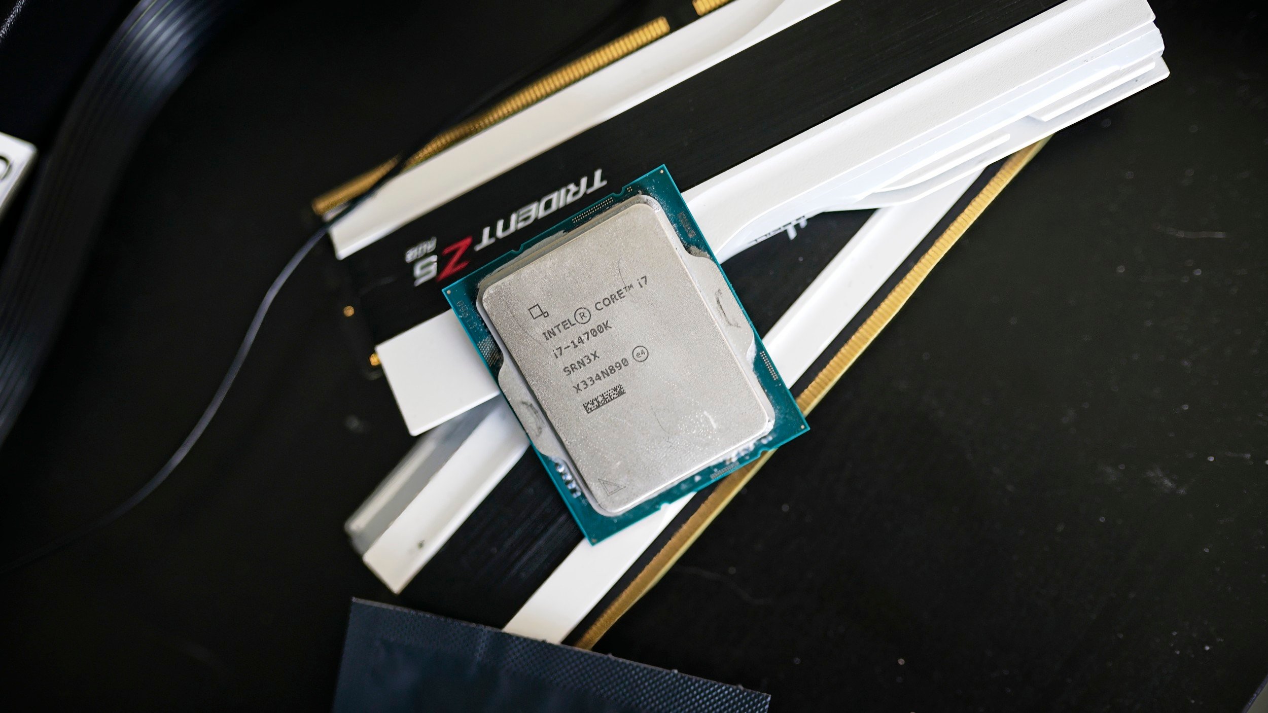 The Intel Core i7-14700K sitting on RAM sticks.