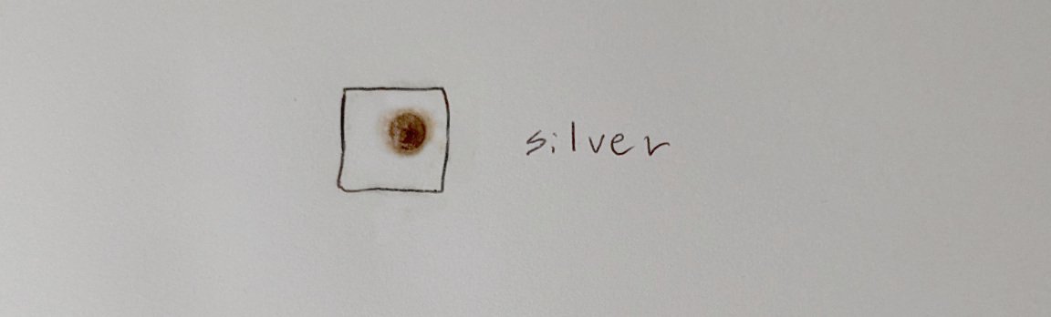 Dark brown spot on paper