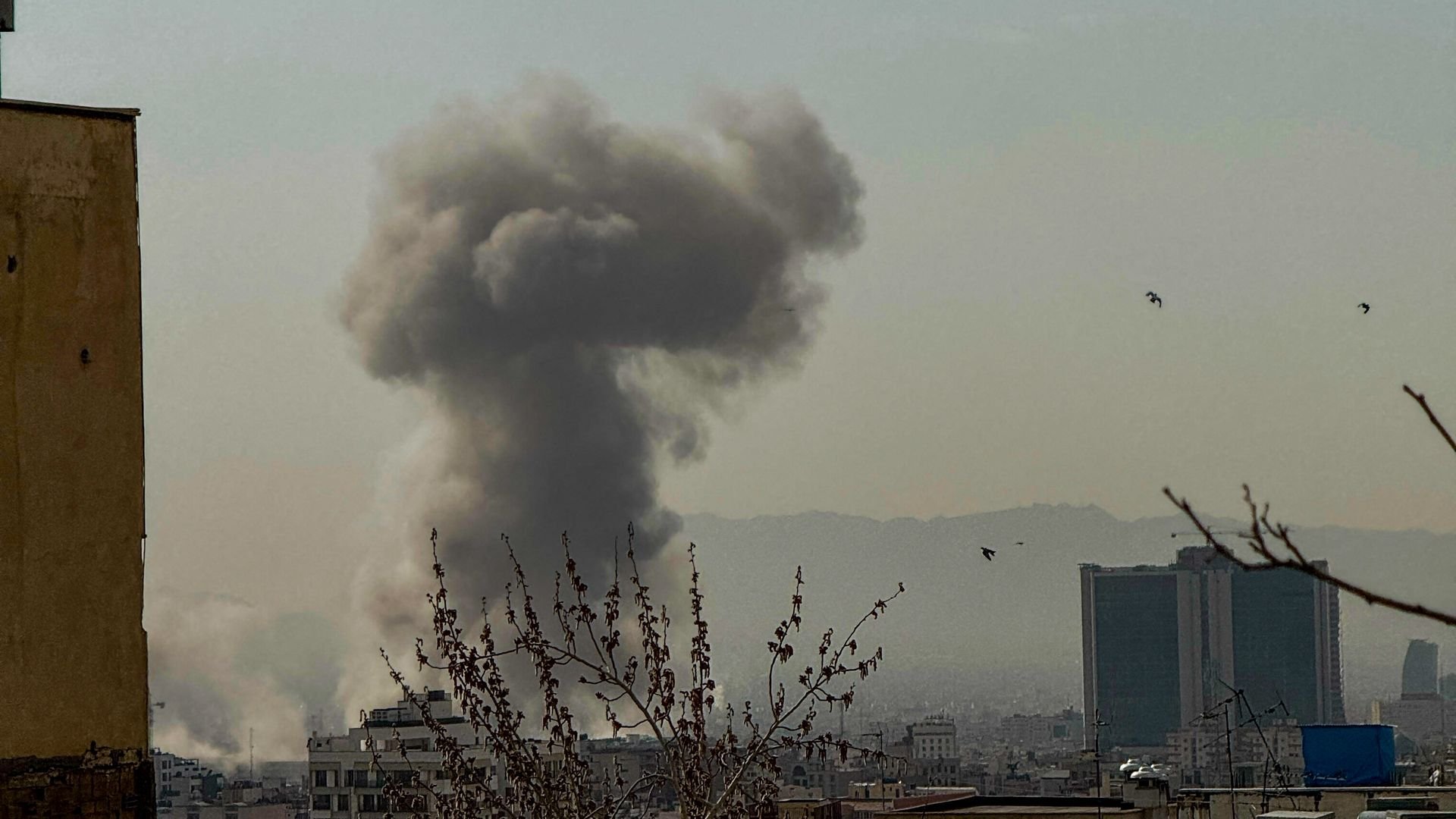 A plume of smoke rises over Tehran after the U.S. and Israel attacked Iran on Feb. 28. 