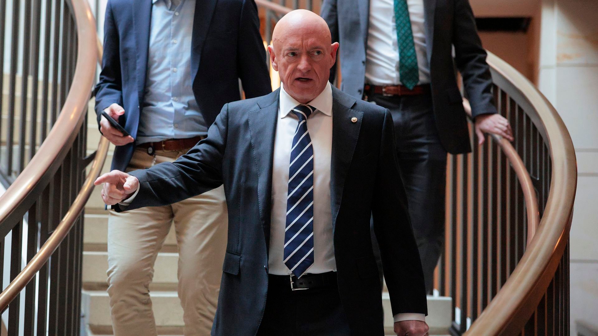 Mark Kelly hits Hegseth with lawsuit over Navy rank demotion threats - Axios Phoenix