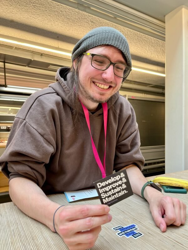 Jan at FOSS Backstage in March 2025 holding a