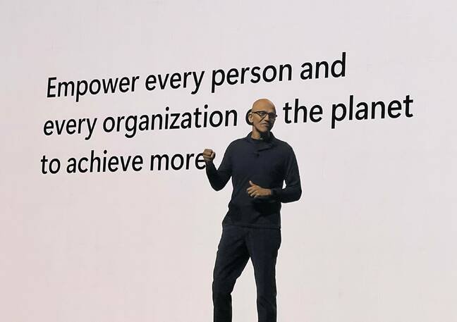 Satya Nadella in front of a white screen delivering the keynote for Microsoft's London AI Tour