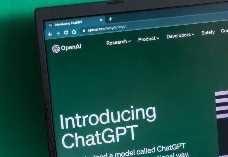 Laptop screen displaying the introductory page of ChatGPT on OpenAI's website.