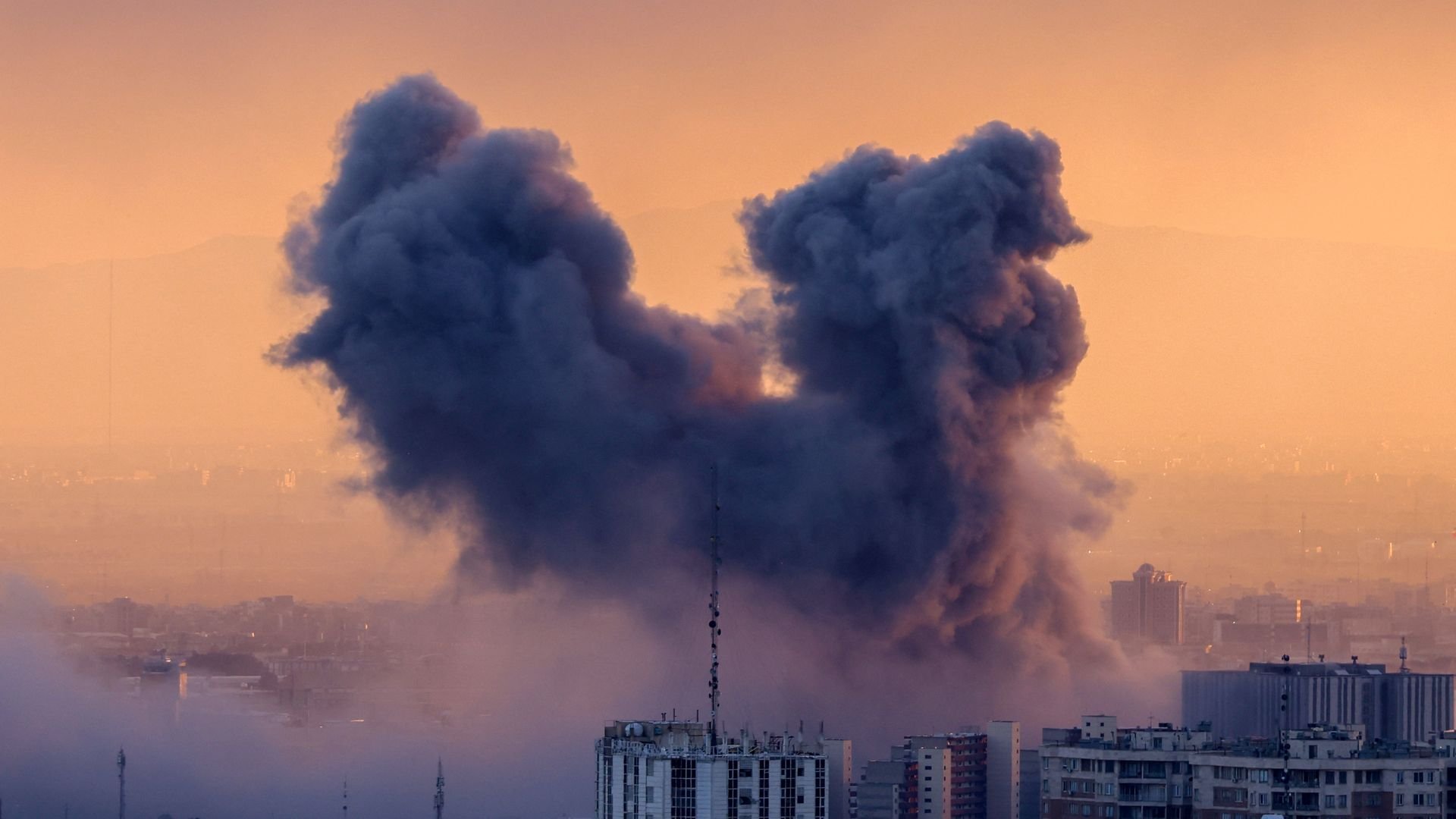 An explosion from an air strike in Tehran