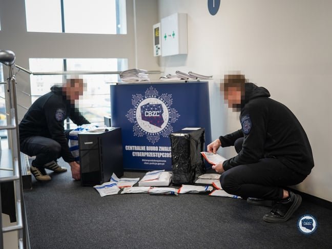 CBZC officers pose with seized evidence taken from alleged DDoS gang members' residences