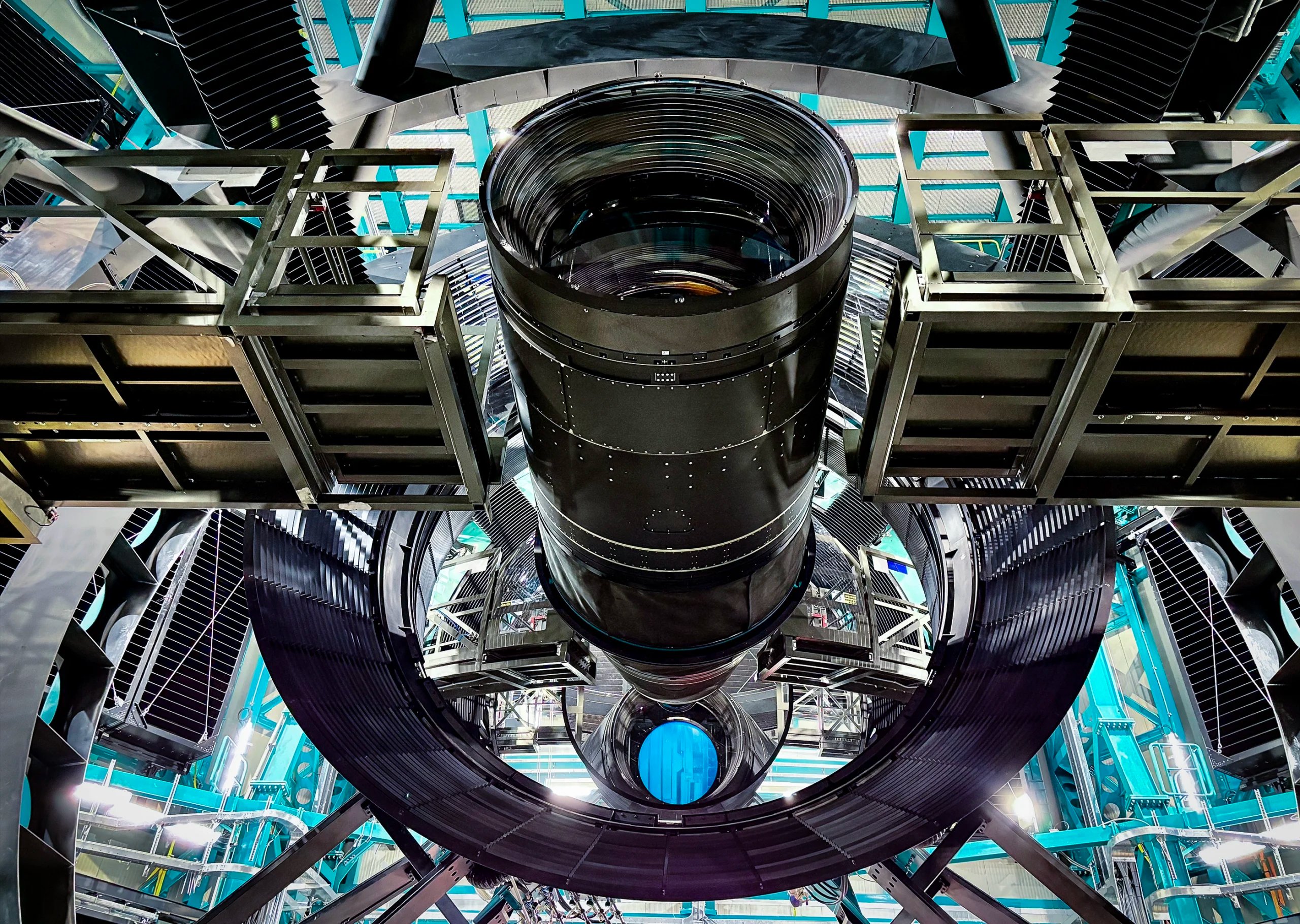 View of the car-size LSST Camera from a low angle, with its secondary and tertiary mirrors in view.