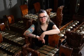 Leslie Tilley surrounded by musical instruments