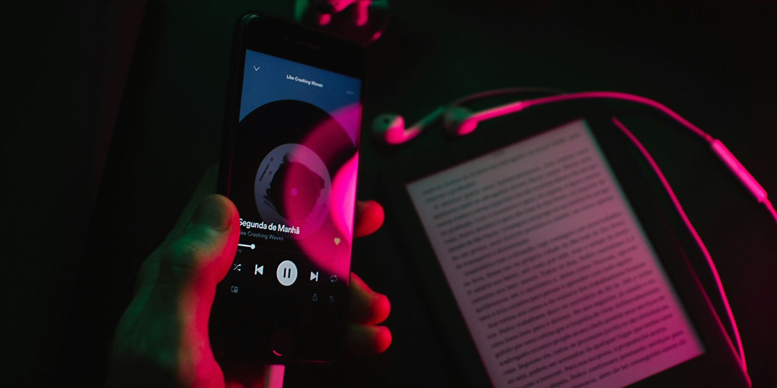 Spotify increases US pricing by 8%, makes at least some people happy | App seen on a smartphone with a Kindle in the background