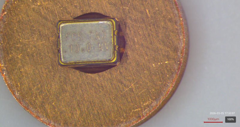 Top view of the TCXO mounted to a copper disk
