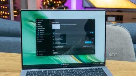 A Windows 11 laptop running PowerToys with the FancyZones settings page open