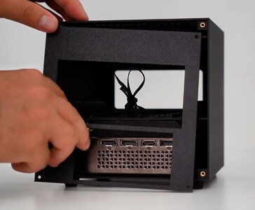 Rear view of the ITG Cube showing mini PC ports, OCuLink connection, and RTX 4060 graphics card outputs