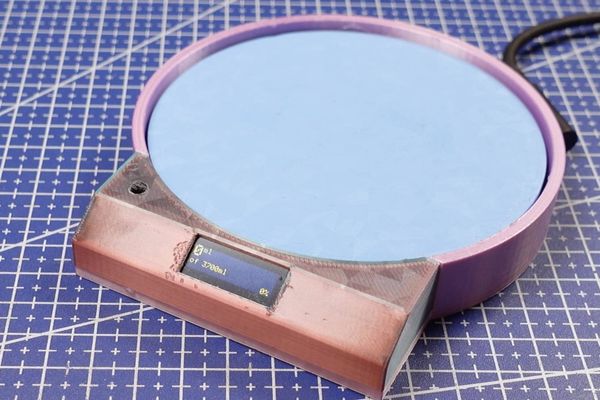 This DIY ESP32 coaster will make sure you drink your water, or else