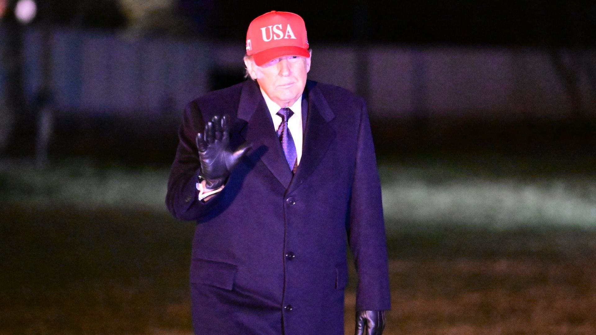 US President Donald Trump walks on the South Lawn of the White House after arriving on Marine One as joint U.S.â