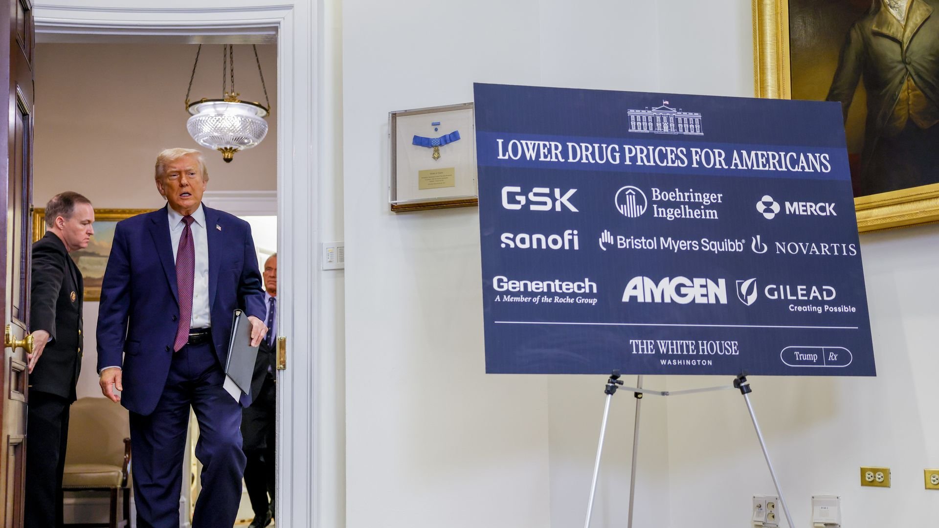President Donald Trump walks into the Roosevelt Room at the White House for an announcement about agreements with pharmaceutical companies on drug pricing.