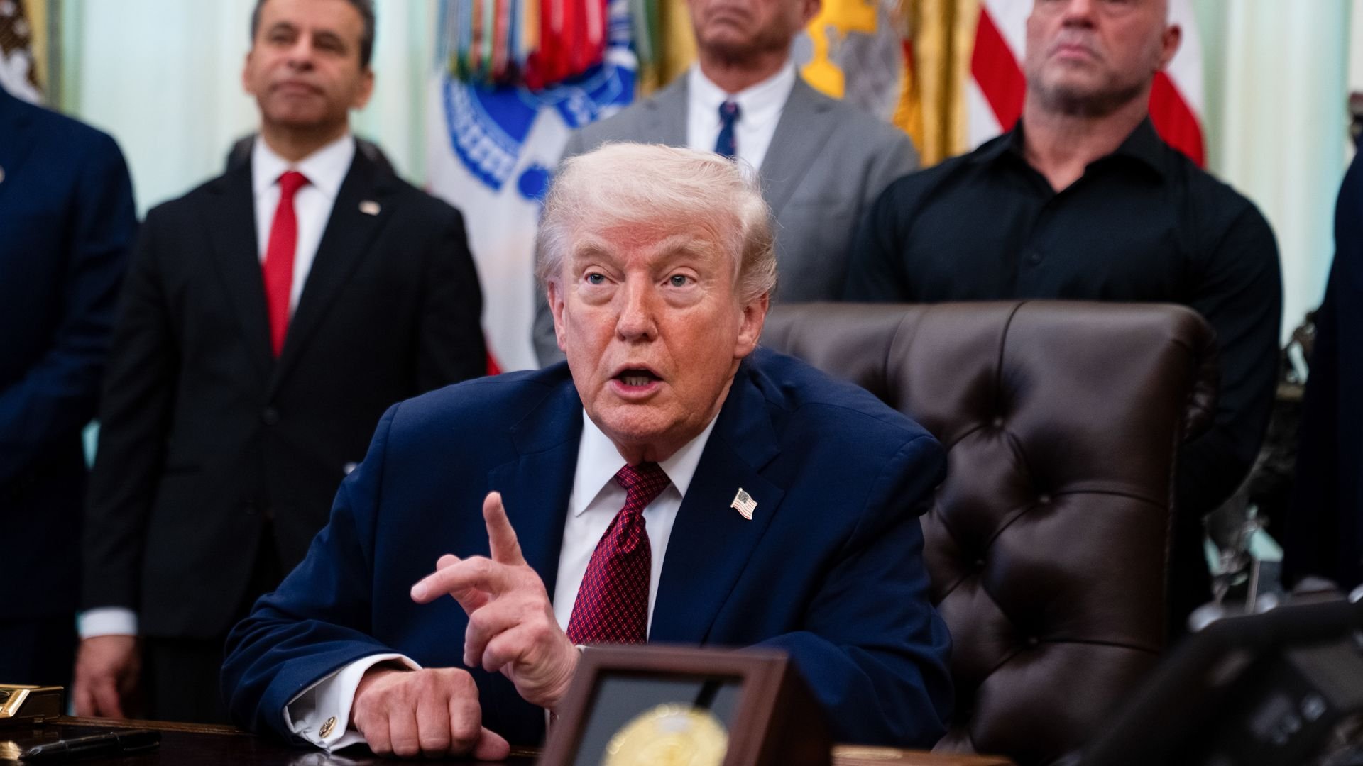 US President Donald Trump, Robert F. Kennedy Jr., US secretary of Health and Human Services (HHS), and media personality Joe Rogan during an executive order signing in the Oval Office of the White House in Washington, DC, US, on Saturday, April 18, 2026