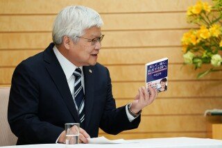 Taiwan Semiconductor Manufacturing Company's Chairman C.C. Wei talks about a book written by Japanese Prime Minister Sanae Takaichi during a meeting with Takaichi at the prime minister's office in Tokyo, Thursday, Feb. 5, 2026. (Kazuhiro Nogi/Pool Photo via AP)