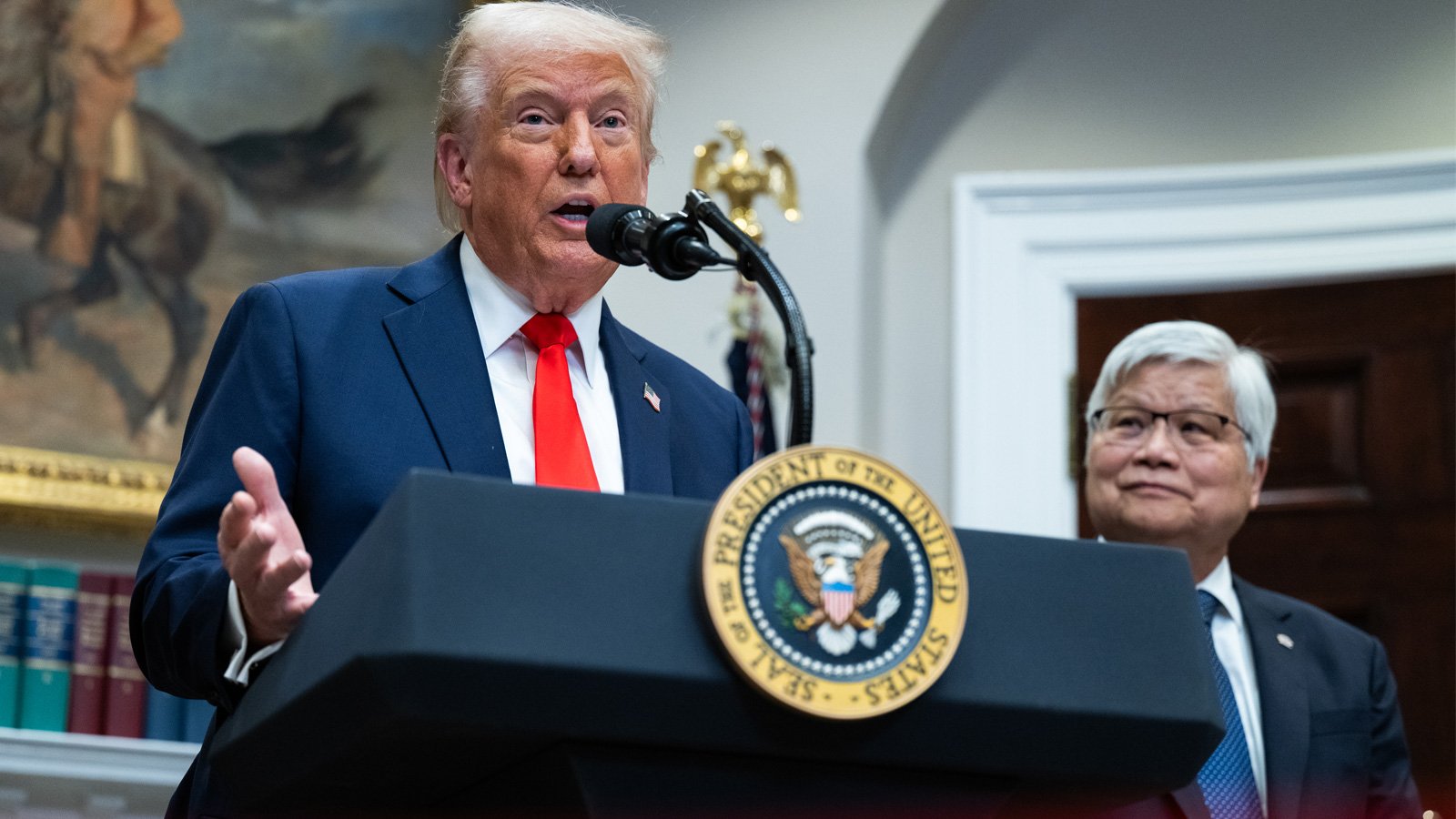 Donald Trump and TSMC CEO at press conference.