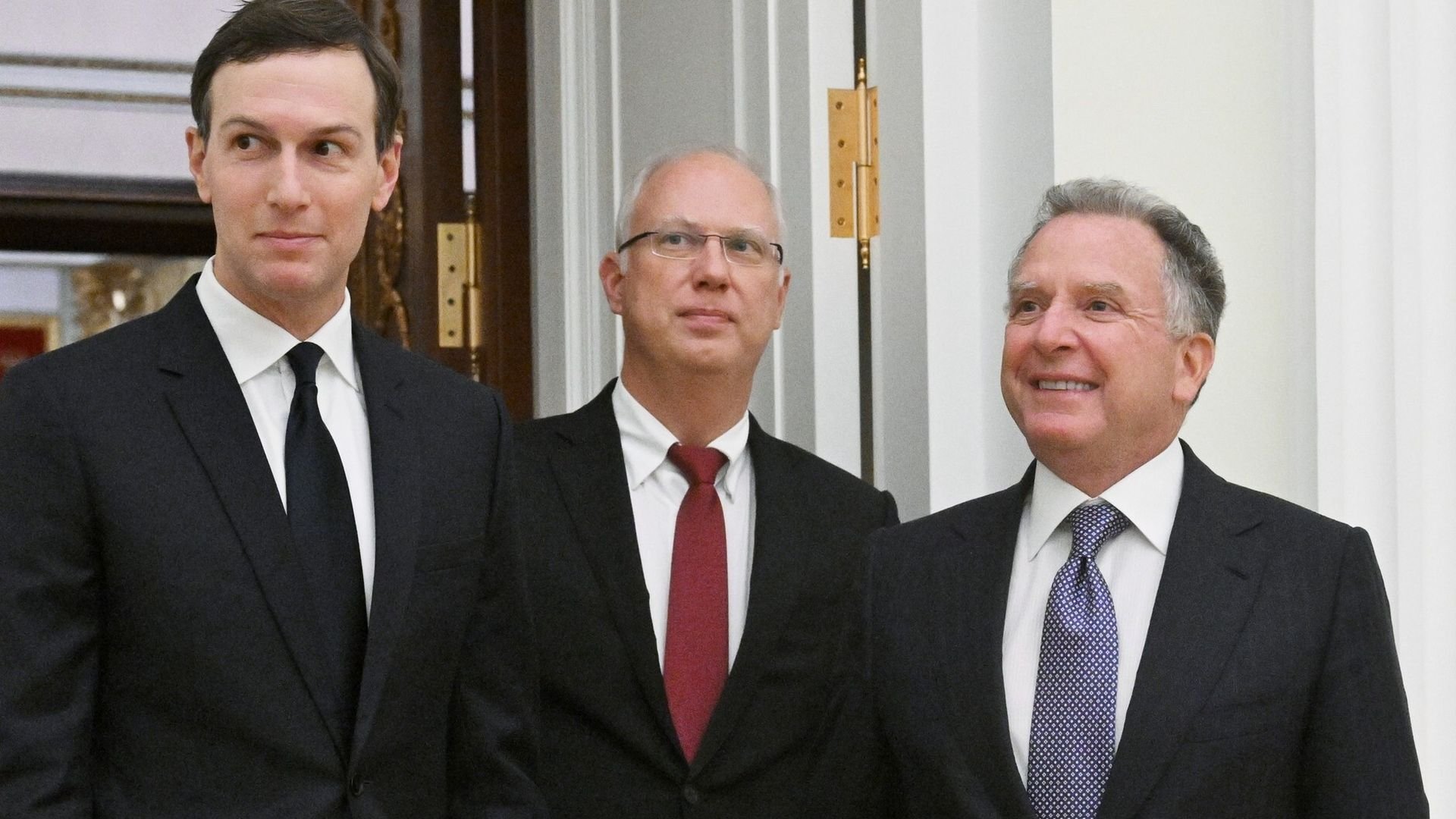 Men smiling in suits